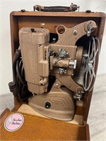Ampro 8mm projector with manual and accessories