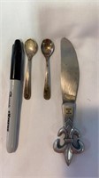 2 small silver spoons and a small butter knife