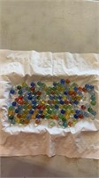 135 cats eye marbles.