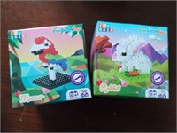 2 boxes building block animals