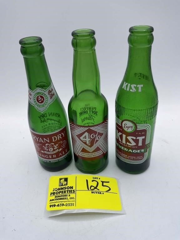GROUP OF THREE GREEN GLASS BOTTLES TO INCLUDE KIST