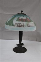 Cast base table lamp with frosted, painted shade,