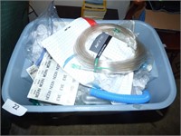 TRASH CAN FULL OF CPAP MASKS AND OXYGEN  HOSES