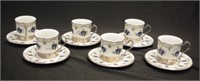 Set of six ceramic & silver coffee cups & saucers