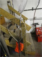 2 fishing nets and orange vest
