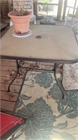 Outdoor glass top table, good condition needs