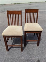 Two wooden upholstered bar stools