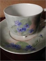 Footed teacup saucer and plate