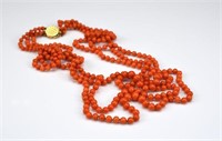 Triple strand coral beaded necklace
