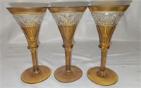 Lot of 3 amber colored crystal champagne glasses