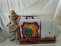 Bisque doll with chair and three Barbie doll cases
