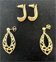 Two pair of possible gold earrings.