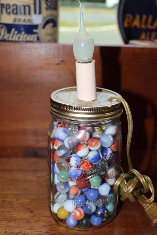 Marbles contained in a Ball jar that has been