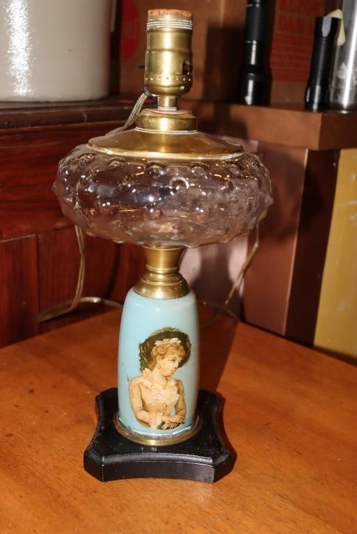 Victorian woman figurine lamp with metal base and