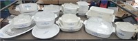 Corning ware blue and white casseroles on cart 34