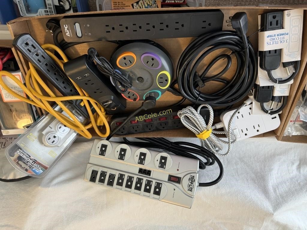 Box with: Several large power strips, (2) 3