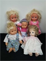 Group of baby dolls one is precious moments