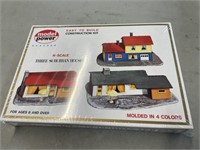 Three suburban houses construction kit-sealed