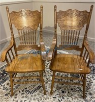 Two press back arm chairs