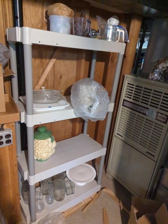 4 tiered plastic shelf with contents