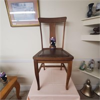 Wooden chair and clown