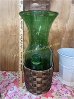 Green glass vase with woven basket