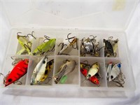 Vintage fishing lures in small plastic tackle box
