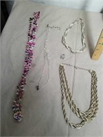 4 necklaces with one clip on earrings