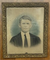 Early framed photo of young man in a suit with