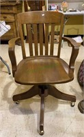 Vintage tiger oak office chair with saddle seat