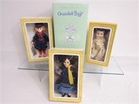 4 BOXED DOLLS: