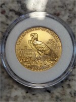 Gold eagle coin stamped copy left hand side. See