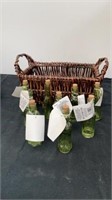Basket with green glass bottles