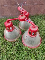 3 Prong Red metal light with glass globes.