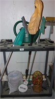 yard tool storage shelf with misc items