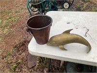 Brass dolphin and copper bucket