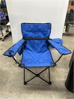 Blue fold out chair with bag