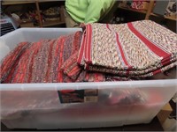 Tote of rugs, blankets.