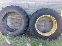 Old pickup and 2 old tractor tires one with rim