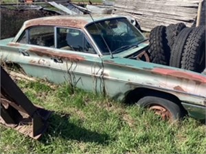 Scrap. Olds car body, dozer blade, wood saw and