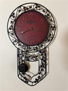 Hanging wall clock with pendulum