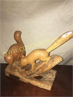 Handcarved pair of squirrels chasing a nut