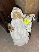 3 Dolls on metal stand, 24 in tall
