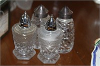 Two sets of salt and pepper shakers
