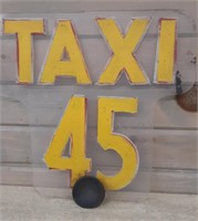 Plastic TAXI 45 sign