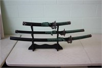 3 Decorative Samurai Swords on Rack