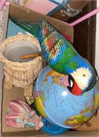Box of miscellaneous collectibles, globe, parrot