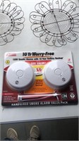 120v smoke alarms, tin of buttons and 2 others