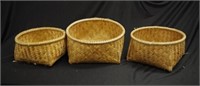 Three woven cane baskets