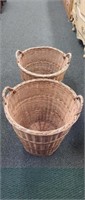 Two large wicker woven double handled baskets
